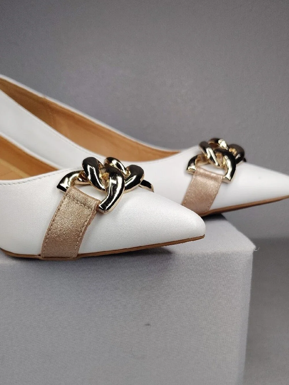 Adrienne Vittadini White Kitten Heels Rose Gold Accents Holding Gold Chain